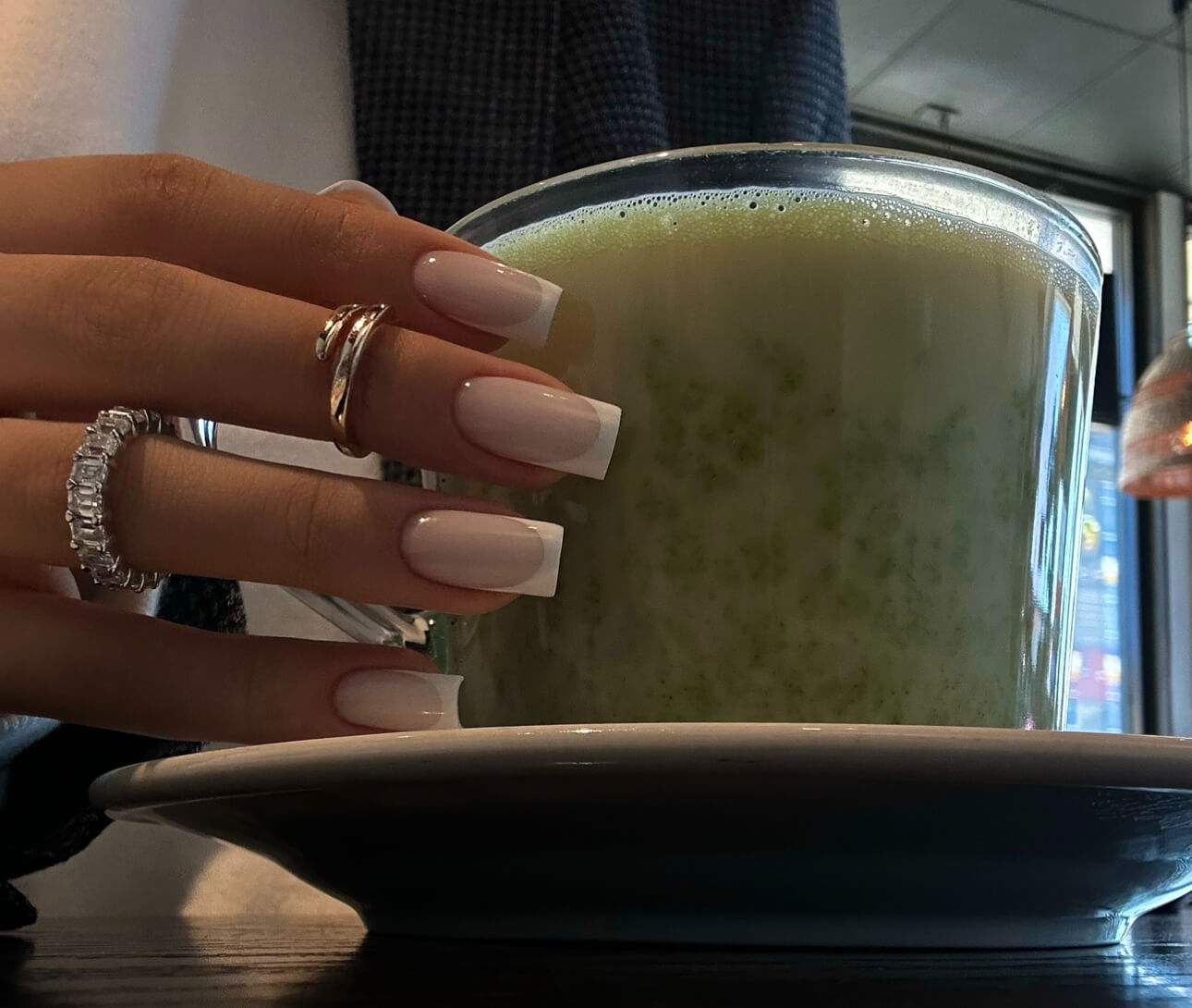 Luxury French nails after Russian Manicure in a lifestyle setting — elegant long square shape