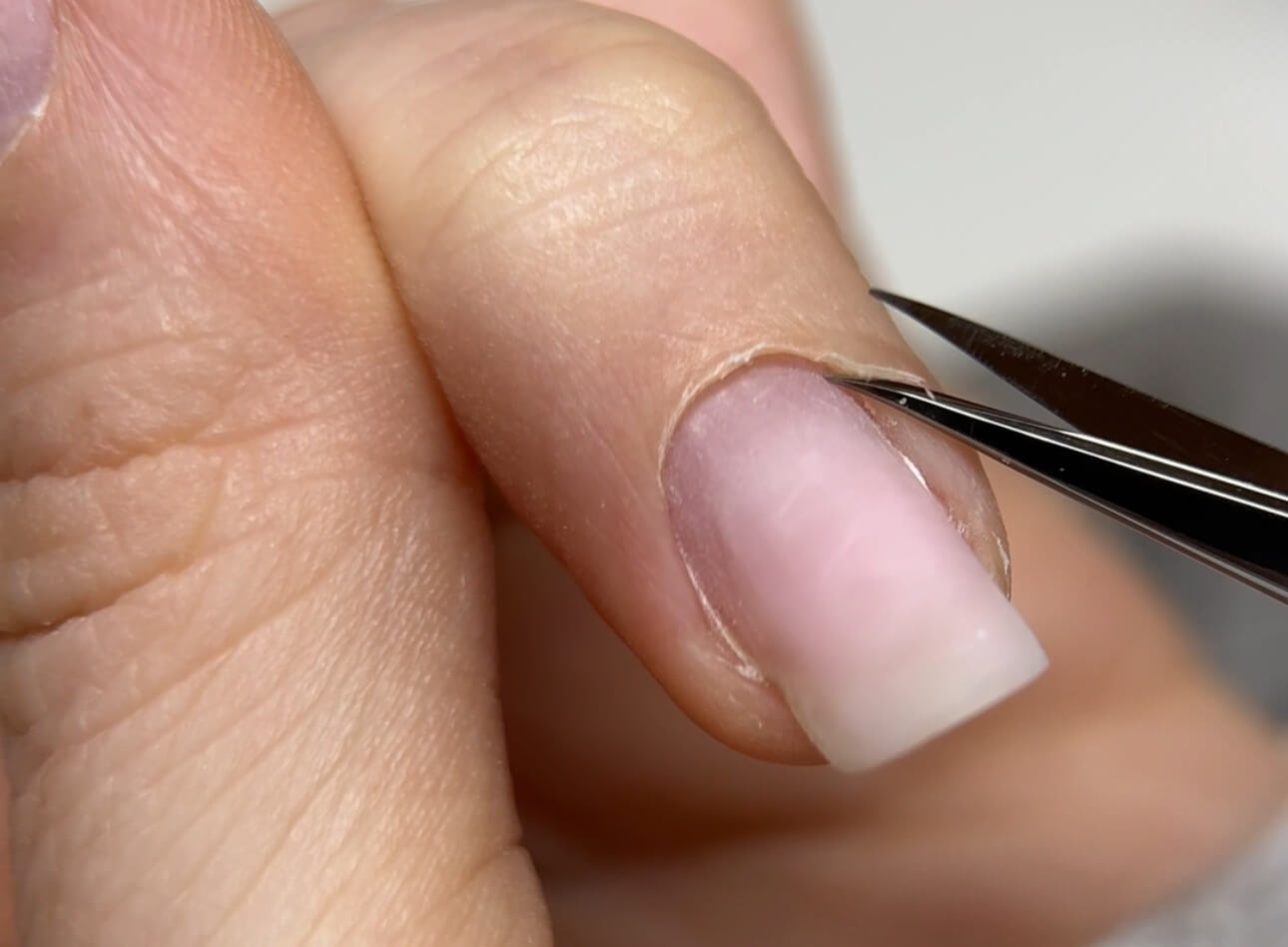 E-file Russian Manicure prep — lifting the cuticle before cleaning the nail plate